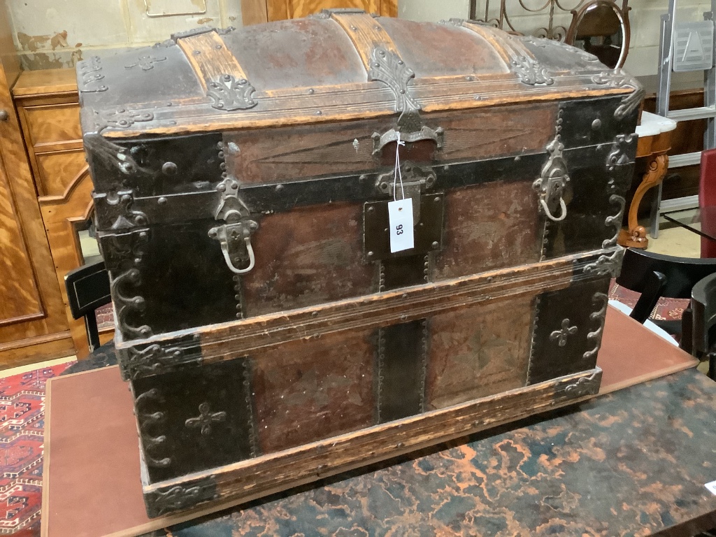 A late Victorian leather and metal mounted dome top trunk with scrap-work interior, length 76cm, depth 48cm, height 62cm